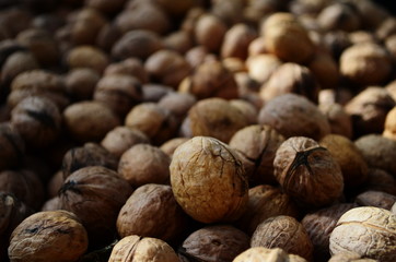 Natural walnut background pattern texture Abstract walnuts heap pattern background Blurred edges frame Natural food in-shell nuts walnuts