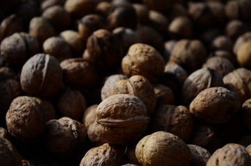 Natural walnut background pattern texture Abstract walnuts heap pattern background Blurred edges frame Natural food in-shell nuts walnuts