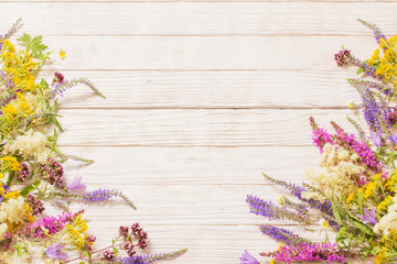 wildflowers on white wooden background