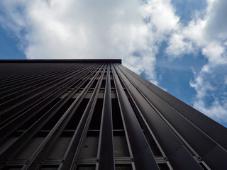 Fototapeta premium Architectural buildings of a modern city. Glass, metal structures - new technologies in construction.