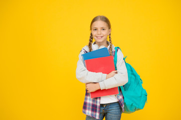 Teen with backpack and books. Motivated and diligent. Stylish schoolgirl. Girl little fashionable schoolgirl carry backpack. Schoolgirl daily life. School club. Modern education. Private schooling