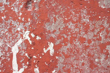 Red painted wall with white cracks background