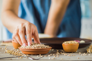 woman hands holding grain in hands
