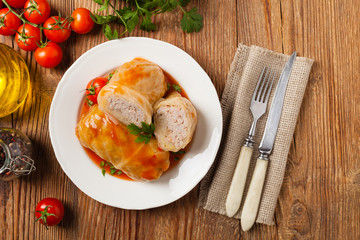Traditional stuffed cabbage with minced meat and rice, served in a tomato sauce.