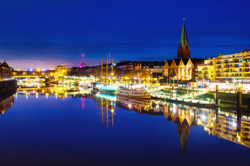 View of the cityscape of Bremen, Germany at night. Illuminated landmarks