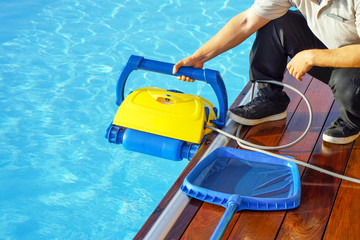 Pool cleaner during his work. Cleaning robot for cleaning the botton of swimming pools. Automatic...