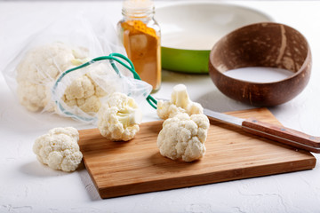 Turmeric and coconut milk baked cauliflower, vegetable recipe. Vegetarian or vegan diet, healthy food concept.