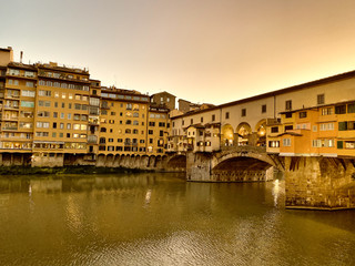 Old Bridge and Florence Lungarni at night. Panoramic cityscape in Autumn, Tuscany - Italy