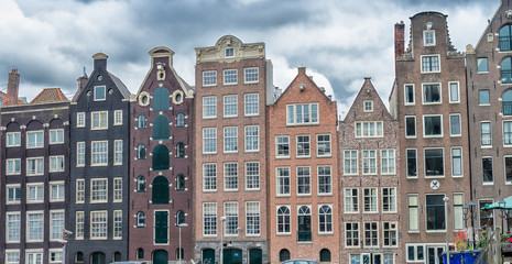 Obraz premium Beautiful houses of Amsterdam along city canal