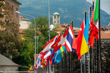 A row of international flags blowing in the breeze at a world championship event