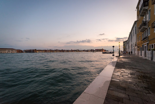 Wide angle view of the Giudecca Canal in Venice, Italy in the early evening light