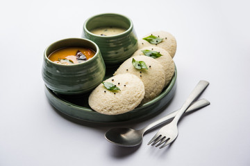 Idli Sambhar or Idly Sambar is a popular south Indian food, served with coconut chutney. selective focus