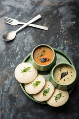 Idli Sambhar or Idly Sambar is a popular south Indian food, served with coconut chutney. selective focus