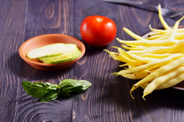 Fresh vegetables on the table. Cutting a delicious salad for vegetarians.