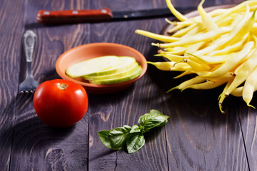 Fresh vegetables on the table. Cutting a delicious salad for vegetarians.