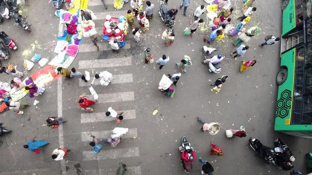 People walking through busy KR Market, Bangalore - Drone shot