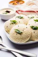 Idli Sambhar or Idly Sambar is a popular south Indian food, served with coconut chutney. selective focus