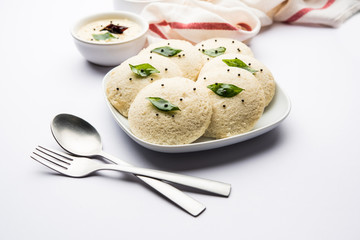 Idli Sambhar or Idly Sambar is a popular south Indian food, served with coconut chutney. selective focus