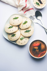 Idli Sambhar or Idly Sambar is a popular south Indian food, served with coconut chutney. selective focus