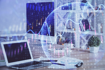 Double exposure of forex chart and work space with computer. Concept of international online trading.