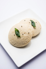 Idli Sambhar or Idly Sambar is a popular south Indian food, served with coconut chutney. selective focus