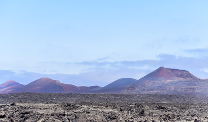 Fototapeta na wymiar Fire Mountains (Montanas del Fuego) in Timanfaya National Park, Lanzarote, Canary Islands, Spain