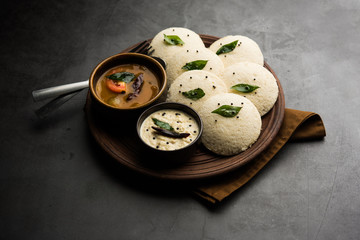 Idli Sambhar or Idly Sambar is a popular south Indian food, served with coconut chutney. selective focus