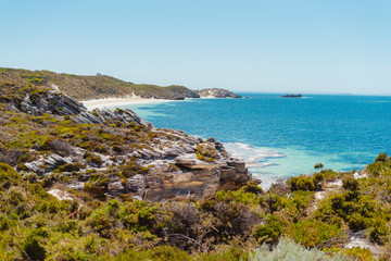 Fototapeta na wymiar Rottnest Island, Perth, Western Australia. Beautiful clear blue waters with unique landscape, shot aerially with a drone. The island is perfect for swimming, snorkelling and exploring. 