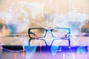 Business theme hologram with glasses on the table background. Concept of search. Double exposure.