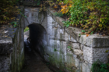 Gray stone tunnel. Passage through the tunnel
