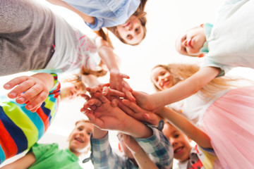 Group of children put their hands together. Teamwork concept