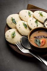 Idli Sambhar or Idly Sambar is a popular south Indian food, served with coconut chutney. selective focus