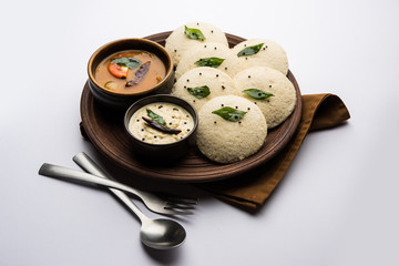 Idli Sambhar or Idly Sambar is a popular south Indian food, served with coconut chutney. selective focus