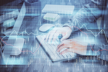 Double exposure of financial graph with man works in office on background. Concept of analysis.
