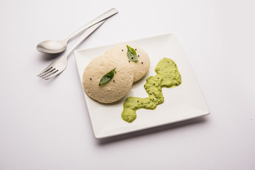 Idli Sambhar or Idly Sambar is a popular south Indian food, served with coconut chutney. selective focus