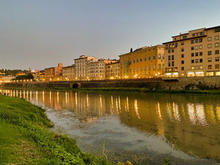 Fototapeta premium Old Bridge and Florence Lungarni at night. Panoramic cityscape in Autumn, Tuscany - Italy