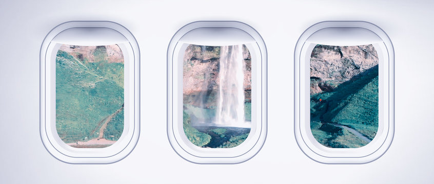 Airplane interior with window view of Seljaland Waterfalls, Iceland. Concept of travel and air transportation © jovannig