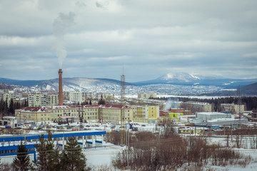 Fototapeta premium Panorama of the city located high in the mountains in the southern Urals. Zlatoust. Russia. winter cityscape