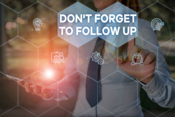 Handwriting text Don T Forget To Follow Up. Conceptual photo asking someone to keep connection with others Woman wear formal work suit presenting presentation using smart device