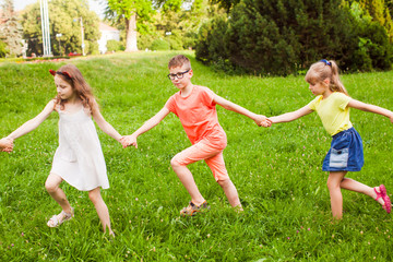 Happy children playing outdoors on a camping holiday