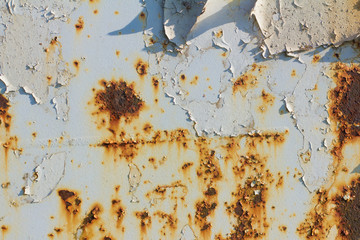 Corroded blue metal background. Rusty blue painted metal wall. Rusty metal background with rust spots.