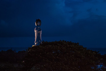 Statue of Guanyin on the territory of Buddhist center Nanshan. Selective focus