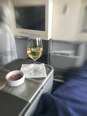Fresh champagne and appetizer served in a first class aircaft environment