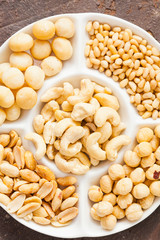 Tasty healthy snack from walnuts, hazelnuts, almonds and cashew, top view, close up