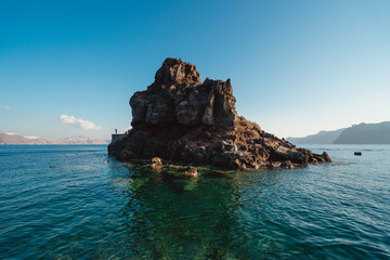 Amoudi Bay, Santorini, Greece. A popular place to swim on the island, the rock provides the perfect spot to snorkle and jump off of. 