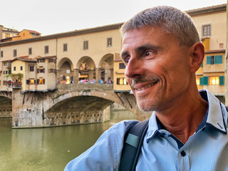 Man looking at Florence Old Bridge