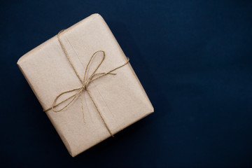 box with red bow on black background