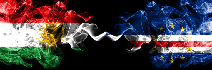 Kurdistan vs Cape Verde smoke flags placed side by side. Thick colored silky smoke flags of Kurds and Cape Verde