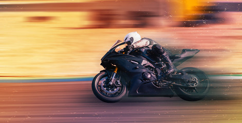 motorcycle racer rides on a sports track - obrazy, fototapety, plakaty