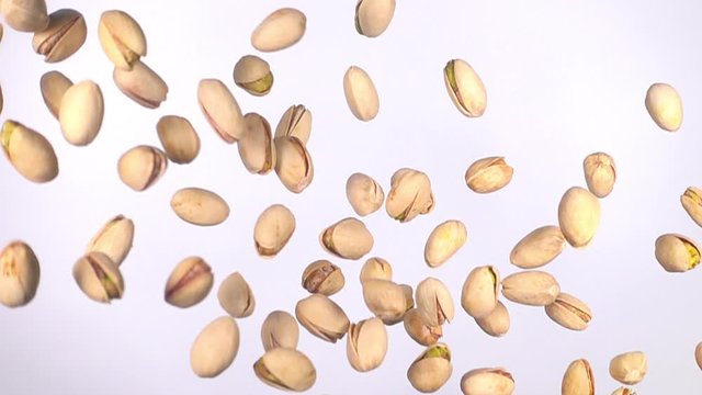 pistachio nuts flying in slow motion